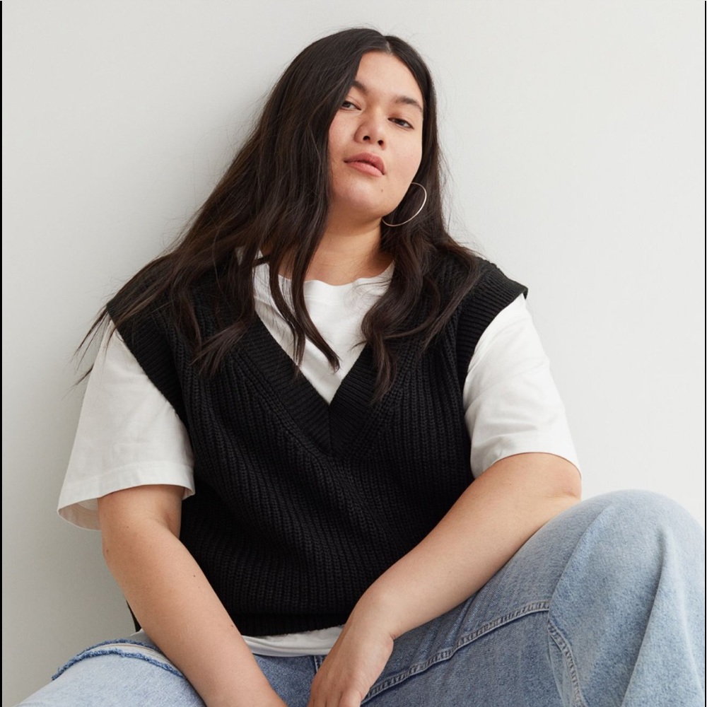 Double-knit sweater vest with a V-neck and ribbing at neckline,armholes and hem.